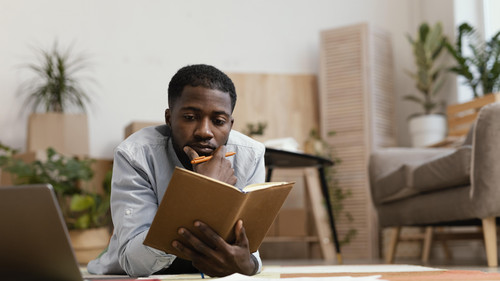 front view man making plans redecorate home.jpg