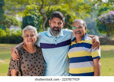 young indian man his parents 260nw 2237877929.jpg