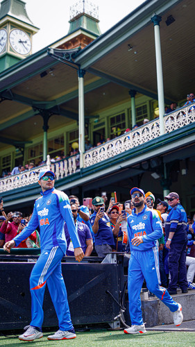 Sydney: Indias captain Shubman Gill and Virat Kohli walk onto the ground before the start of the thi.jpg