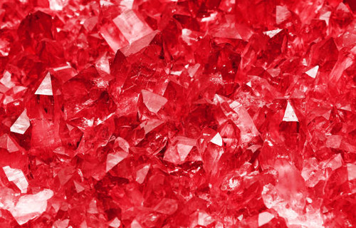 Cluster of clear transparent ruby red quartz mineral crystals (chemical composition SiO2) close up b.jpg
