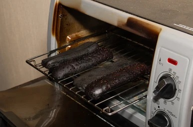small oven very burnt hotdog 260nw 1916789696.jpg
