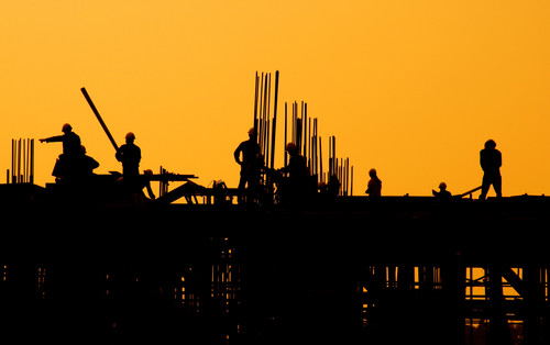 construction workers at sunset.jpg