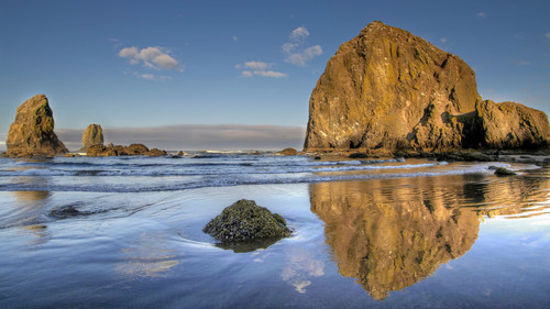 Reflection of Haystack Rock at Cannon Beach, Oregon, USA 1080p.jpg