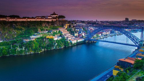 Old Town skyline across the Douro River and The Luis Bridge, Porto sunset, Portugal 1080p.jpg