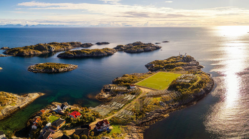 Aerial view of Henningsvær village with its football field, Lofoten archipelago, Norway 1080p