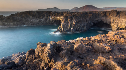 Lava cliffs and volcano skyline, Timanfaya National Park, Lanzarote, Canary Islands, Spain 1080p.jpg