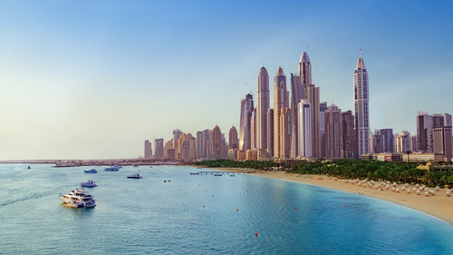 Beach with boats near Dubai Marina with view on the skyline, UAE 1080p
