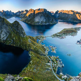 Sunset aerial view from Reinebringen ridge on mountains and village of Reine in Lofoten islands, Nor