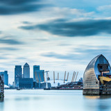 Thames Barrier on River Thames and Canary Wharf in the background, London, England, UK 1080p