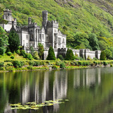 View from water at Kylemore Abbey near trees, Connemara, County Galway, Ireland 1080p