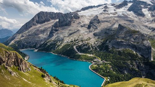 Fedaia Pass with lake at the foot of Marmolada, Dolomites, Italy 1080p.jpg