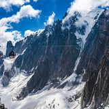 Elevated view of cable cars over snow covered valley at Mont blanc, France 1080p