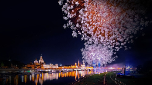 Fireworks lighting up night Sky with skyline of Dresden and reflections in river Elbe, Germany 1080p.jpg