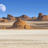 Dasht e Lut (Lut or Kalut) desert with full moon above horizon, Iran 1080p