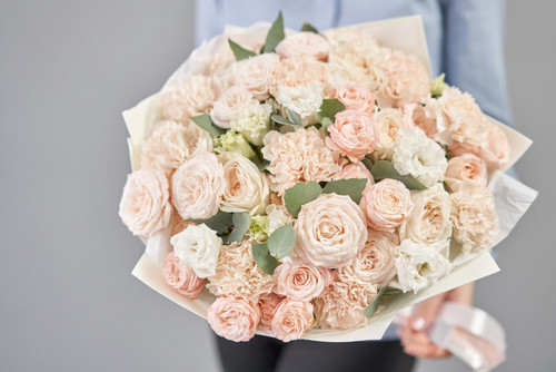 Mono bouquet of spray roses. Delicate bouquet of mixed flowers in womans hands. the work of the flor.jpg