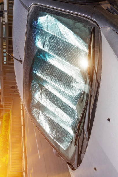 Protective reflective surface under the windshield of the passenger car parked on a hot day, heated .jpg
