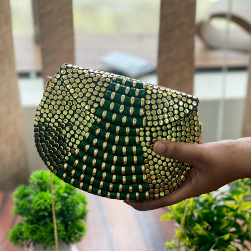 Themaresse Metallic Silver Clutch: Handcrafted Elegance in Every Bag.jpg