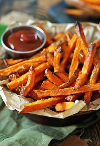 dterox A basket of crispy sweet potato fries with ketchup on 0c495e0c 6261 470a 8ebf 682b070e13af 0.png