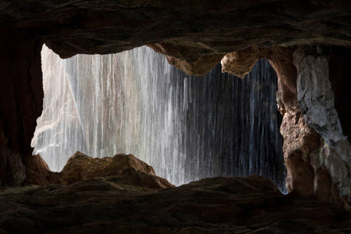 View of the waterfall from the cave inside in Valencia, Spain..jpg