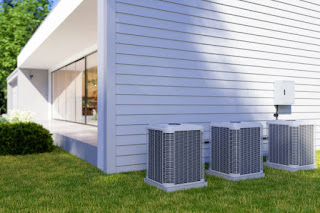 Exterior Of Villa With Air Heat Pumps In The Backyard.jpg