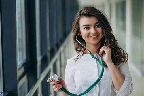 young woman doctor with stethoscope hospital