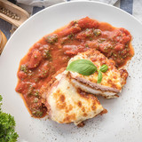 cooking healthy diet food in the home kitchen, Healthy Chicken parmesan with spices in baking dish o.jpg