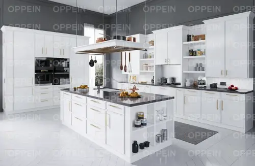 white slim shaker kitchen cabinets with brass hardware.webp