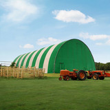 Default green and white large fabric building in the middle of 1