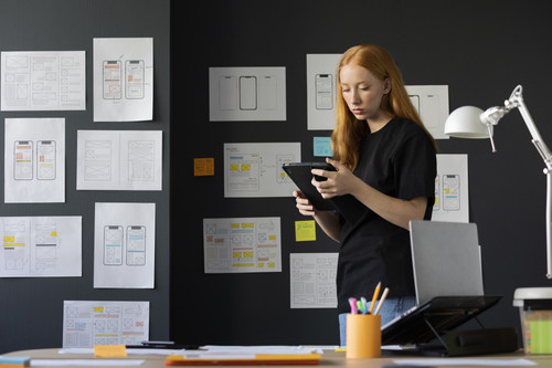 female web designer office with notebook.jpg