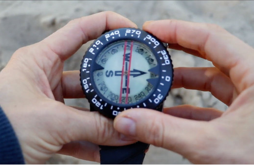 Compass held flat and level