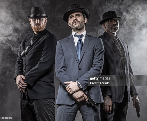 Italian Gangster Mafia Don and bodyguards together in smoky studio shoot.jpg