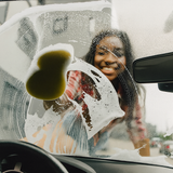 Black girl cleaning glass