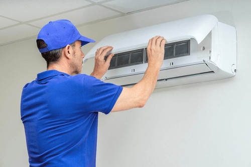 hvac technician performing air conditioner 600nw 2488702851.jpg