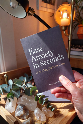 Zainab Lunje Hand holding printable affirmation card beside cozy desk lamp wit a2356f6f f176 41af 86.jpg