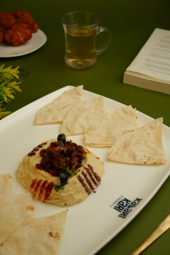 Silky hummus with warm kubboos meat.jpg