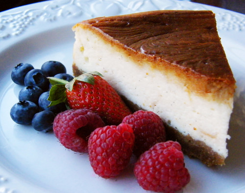 Baked cheesecake with raspberries and blueberries.jpg