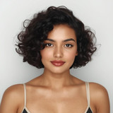Front facing portrait of a beautiful 24 year old Indian fair skinned woman with a Curly Bob — spring