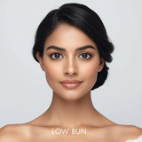 Front facing portrait of a beautiful 24 year old Indian fair skinned woman with a Low Bun — elegant 