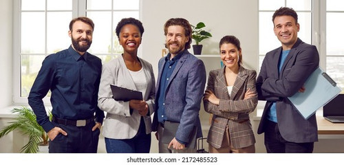 happy diverse business team standing 260nw 2172485523.jpg