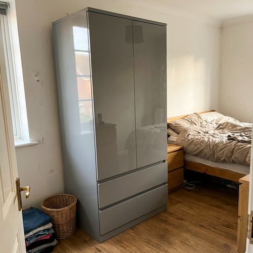 Sorting out my spare room with this grey double wardrobe.png