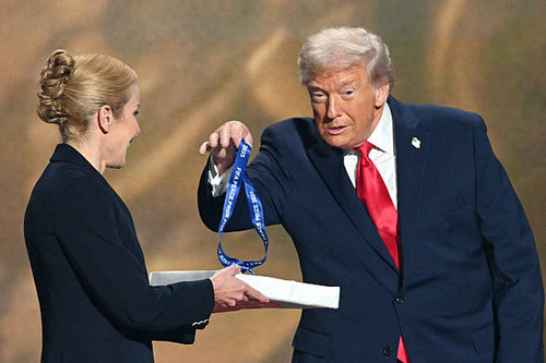 (L-R) US President Donald Trump holds a medal as he receives the FIFA Peace Prize from Italian Fifa .jpg