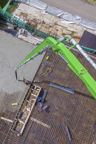 Concrete pouring by crane and concrete pump.jpg