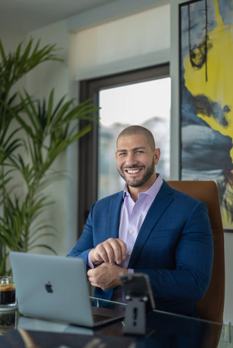 Nathan Levinson, Founder of Royal York Property Management, smiling in blue suit..jpg