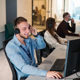 Royal York Property Management customer service team with headsets at office.