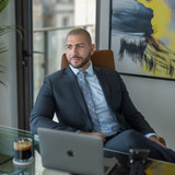 Nathan Levinson, CEO of Royal York Property Management, at executive desk.