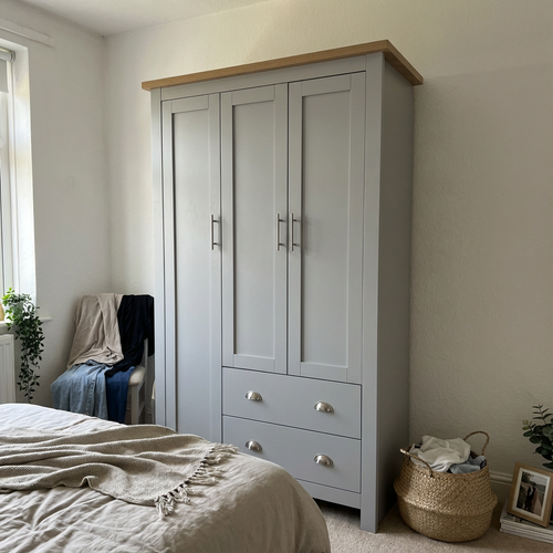 Found a grey triple wardrobe with drawers for my new flat..png