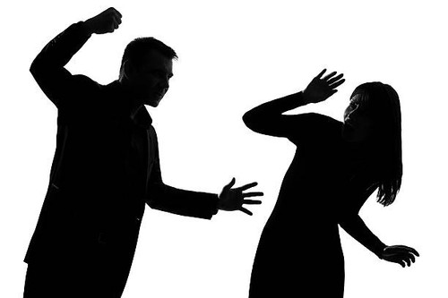 one  couple man and woman expressing domestic violence in studio silhouette isolated on white backgr.jpg