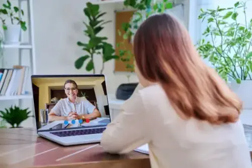 young female on online therapy with psychologist psychotherapist.webp