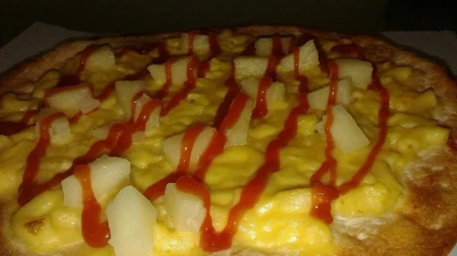 pizza with macaroni pineapple and ketchup on it v0 23wjxvpnb29a1.png