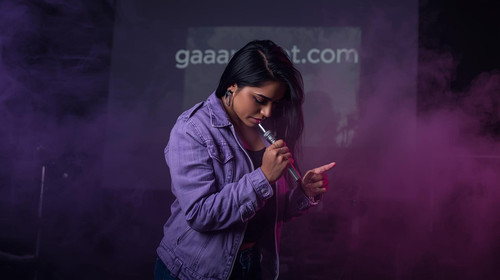 10. Bollywood musician in sexy rugged styling, lavender jacket, scribbling rap lyrics under dark pur.jpg